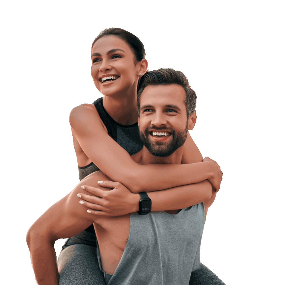 Young and fit couple smiling and embracing | Body Contouring